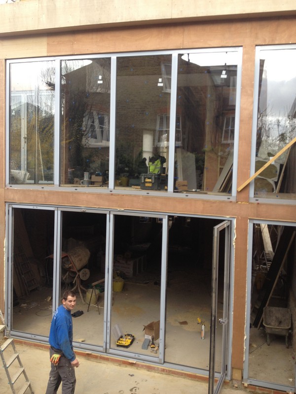 Aluminium bi-fold doors with two-storey glazing in Archway