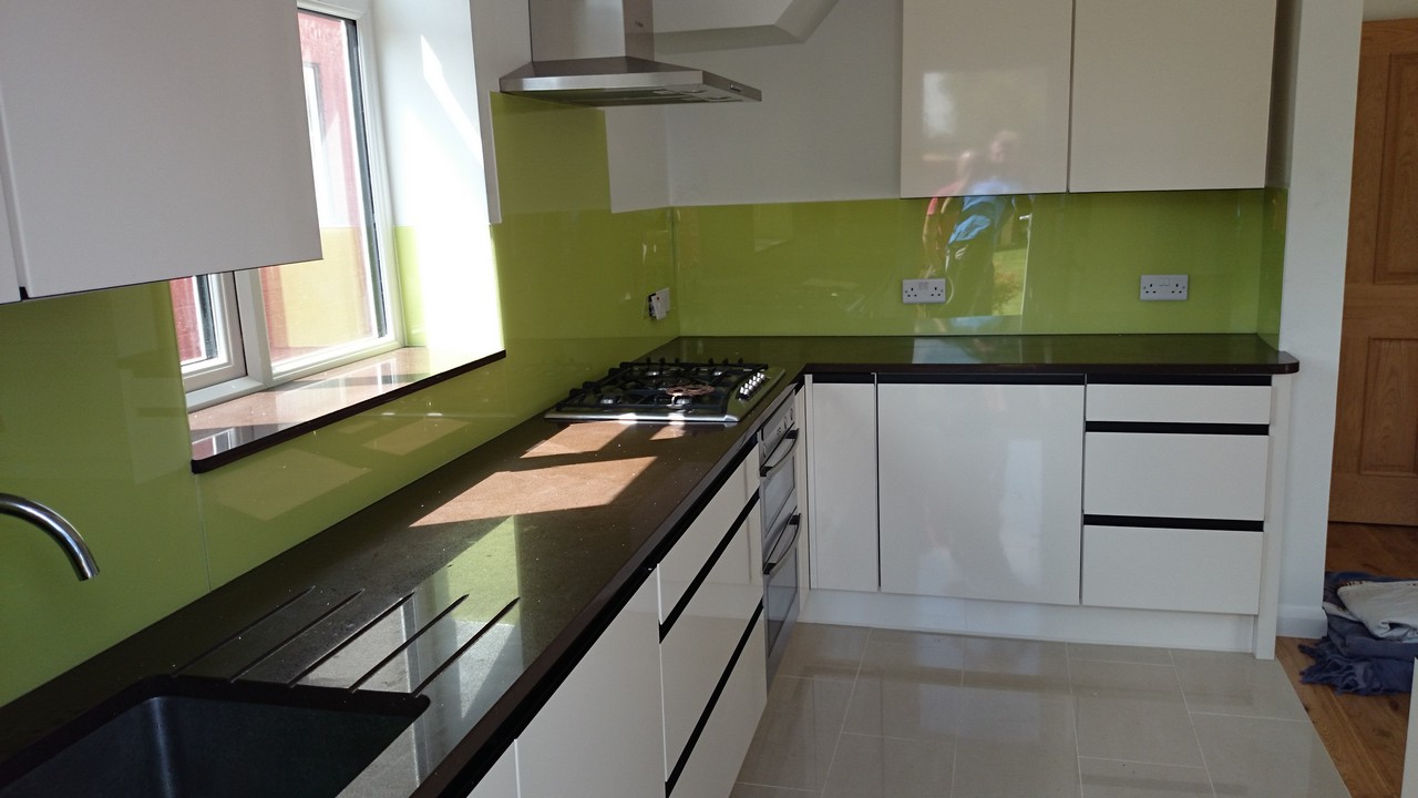 Lime green glass kitchen splashback installed by Archway glaziers